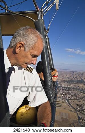 The captain of a hot air balloon; Cappadocia, Turkey View Large Photo Image Stock Image - The captain of a hot air balloon; Cappadocia, Turkey. Fotosearch