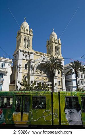 Stock Photo - The Cathedral Of St Vincent De Paul And Tram Passing. Tunis, Tunisia, North Africa.. Fotosearch