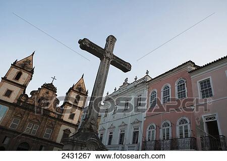Stock Photo - The church of San Francisco and a crucifix monument in Largo Cruziero de San Fancisco, in the Pelourinho historic centre; Salvador, Bahia, Brazil. Fotosearch