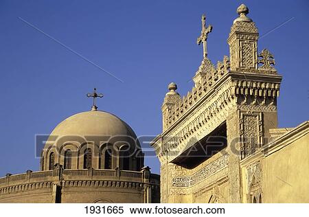 Stock Photography - The Churches Of St George (Left) And Al-Mullaqah (Right) With A Blue Sky Behind, Old Cairo, Egypt; Old Cairo, Egypt. Fotosearch