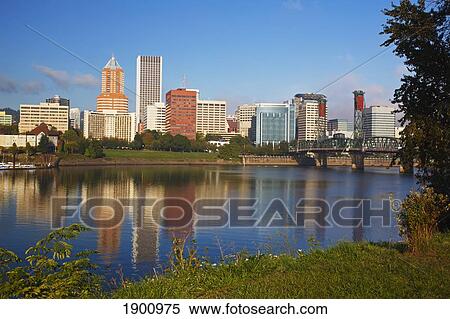 Stock Photography - The City Of Portland Reflected In Willamette River; Oregon, United States Of America. Fotosearch