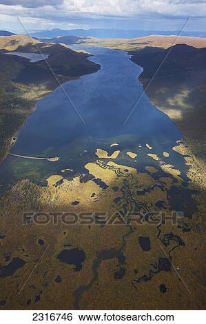 Stock Photograph - The Colors Of Autumn And Fish Lake Seen From The Air; Yukon Canada. Fotosearch