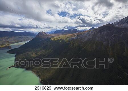 The Colors Of Autumn And The Aquamarine Waters Of Primrose Lake Seen From The Air; Yukon Canada View Large Photo Image Stock Image - The Colors Of Autumn And The Aquamarine Waters Of Primrose Lake Seen From The Air; Yukon Canada. Fotosearch