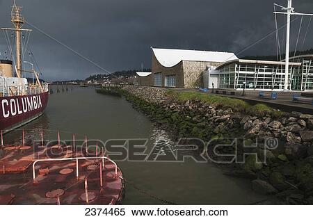 Stock Photography - The Columbia River Maritime Museum sits on the banks of the Columbia River; Astoria, Oregon, United States of America. Fotosearch