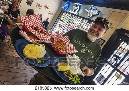 The Cowboy Gelato Restaurant Owner Jim Anderson Serving A Selection Of Homemade Burgers And Sandwiches, Route 66, Amarillo, Usa View Large Photo Image Stock Photography - The Cowboy Gelato Restaurant Owner Jim Anderson Serving A Selection Of Homemade Burgers And Sandwiches, Route 66, Amarillo, Usa. Fotosearch