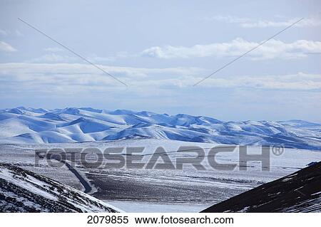 The Dempster Highway Is Seen Winding Through The Tundra During Winter In The Yukon. View Large Photo Image Stock Photography - The Dempster Highway Is Seen Winding Through The Tundra During Winter In The Yukon.. Fotosearch