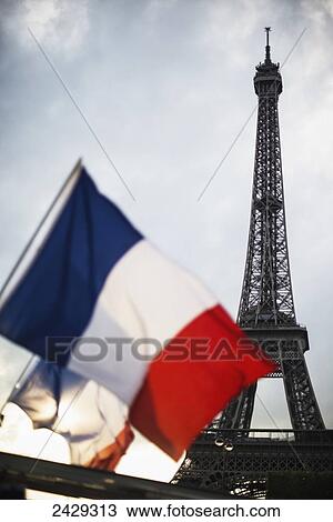 The Eiffel Tower and flag of France at sunset; Paris, France View Large Photo Image Stock Image - The Eiffel Tower and flag of France at sunset; Paris, France. Fotosearch