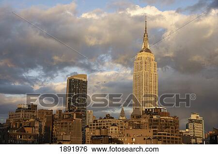 Stock Photograph - The Empire State Building In Midtown Manhattan With Chrysler Building In Background. Fotosearch