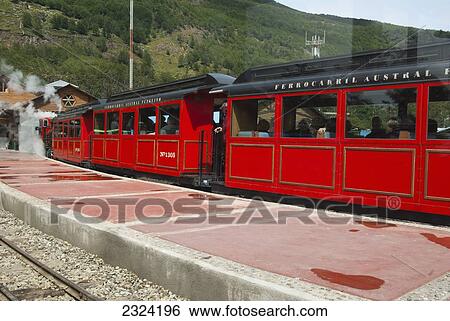 Stock Photograph - The End of The World train arrives at station; Ushuaia, Tierra del Fuego, Argentina. Fotosearch