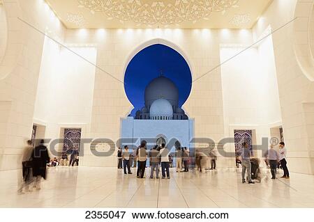 Stock Photo - The entrance of Sheikh Zayed Grand Mosque at night; Abu Dhabi, United Arab Emirates. Fotosearch