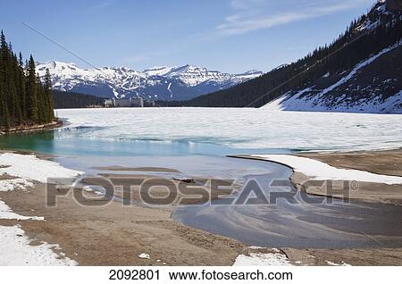 Stock Image - The Fairmont Chateau Lake Louise In Canada's Scenic Rocky Mountain Range; Lake Louise, Alberta, Canada. Fotosearch