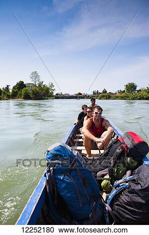 Stock Image - The ferry back to the mainland from the Island of Don Det on the Mekong River; Si Phan Don, Laos. Fotosearch