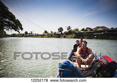 The ferry back to the mainland from the Island of Don Det on the Mekong River; Si Phan Don, Laos View Large Photo Image Stock Photo - The ferry back to the mainland from the Island of Don Det on the Mekong River; Si Phan Don, Laos. Fotosearch