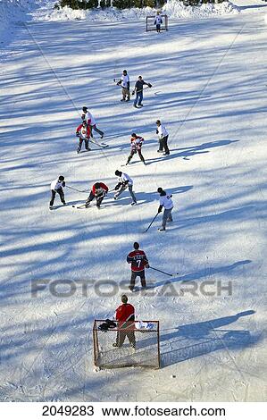 Stock Image - The Forks Pond Hockey Tournament, Forks Historic Port, Assiniboine River, Winnipeg, Manitoba. Fotosearch