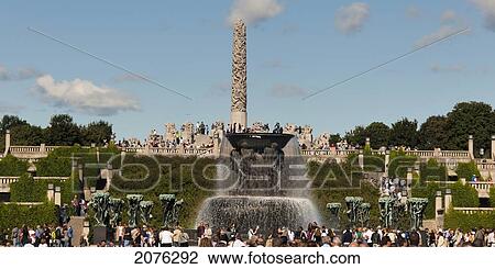 Stock Image - The Fountain Monolith And A Crowd Gathered In Frogner Park Vigeland Sculpture Park; Oslo Norway. Fotosearch