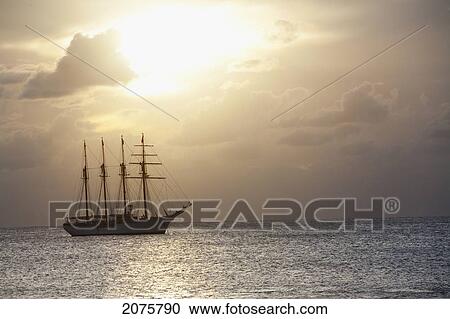 Stock Image - The Four-Mast Barquentine, Chilean Navy Training Ship Esmeralda In Hanga Roa Harbour In The Late Afternoon, Rapa Nui (Easter Island), Chile. Fotosearch