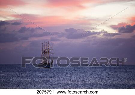 Stock Image - The Four-Mast Barquentine, Esmeralda That Is The Chilean Navy Training Ship In Hanga Roa Harbour At Dusk, Rapa Nui (Easter Island), Chile. Fotosearch