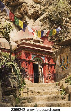 The great Buddhist mahasiddhas, Tilopa and Naropa, sadhu-yogins of the tenth century, meditated in these caves carved out of living rock; Pashupathinath, Nepal View Large Photo Image Stock Image - The great Buddhist mahasiddhas, Tilopa and Naropa, sadhu-yogins of the tenth century, meditated in these caves carved out of living rock; Pashupathinath, Nepal. Fotosearch