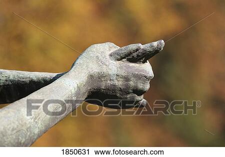 Stock Image - The Hands Of A Stone Statue. Fotosearch