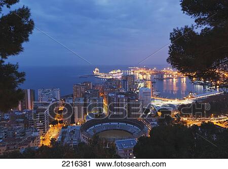 Stock Image - The Harbour And City Seen From High Across The Bullring; Malaga Malaga Province Costa Del Sol Andalusia Spain. Fotosearch