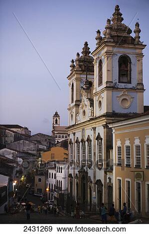 The historic colonial-era buildings of the Largo de Pelourinho square in the old upper city, on the right is the Slave Church of Nosso Senhor Do Rosario Dos Pretos built by former slaves; Salvador, Bahia, Brazil View Large Photo Image Stock Photo - The historic colonial-era buildings of the Largo de Pelourinho square in the old upper city, on the right is the Slave Church of Nosso Senhor Do Rosario Dos Pretos built by former slaves; Salvador, Bahia, Brazil. Fotosearch