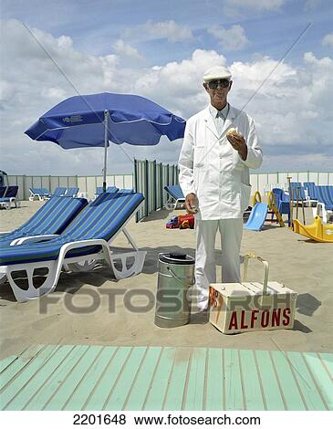 The Ice Cream Man Alfons On A Summer Day At The Belgian Seaside. Ostende, Belgium. View Large Photo Image Stock Photo - The Ice Cream Man Alfons On A Summer Day At The Belgian Seaside. Ostende, Belgium.. Fotosearch
