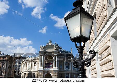 Stock Photography - The Italian baroque facade of the Odessa Opera and Ballet Theatre, and classical street lighting with historic buildings in Odessa City centre; Odessa, Ukraine. Fotosearch
