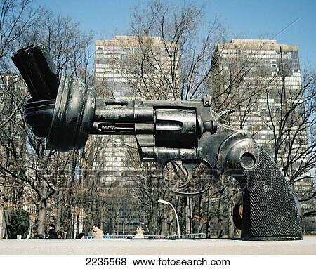 The knotted gun sculpture 'Non violence', Carl Fredrik Reutersward, outside United Nations Headquarters, New York, U. S. A. View Large Photo Image Stock Photo - The knotted gun sculpture 'Non violence', Carl Fredrik Reutersward, outside United Nations Headquarters, New York, U. S. A.. Fotosearch
