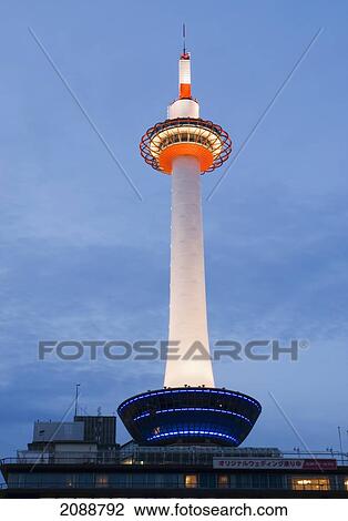 Stock Image - The Kyoto Tower At Sunset; Kyoto, Japan. Fotosearch