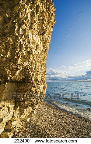 Stock Image - The limestone cliffs of Steep Rock along Lake Manitoba; Manitoba, Canada. Fotosearch