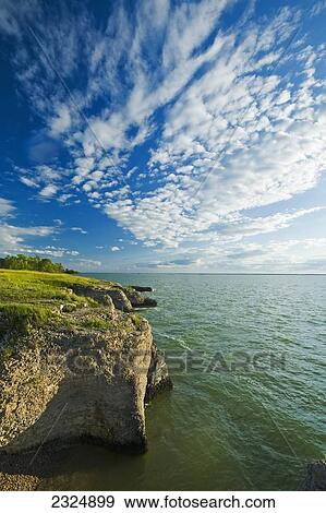 Stock Photo - The limestone cliffs of Steep Rock along Lake Manitoba; Manitoba, Canada. Fotosearch