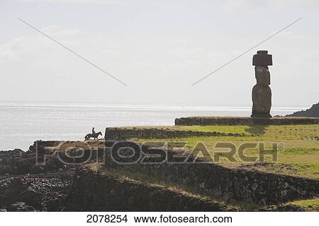 The Moai Of Ahu Ko Te Riku At The Tahai Ceremonial Complex Statue, Restored By William Mulloy Is The Only Statue To Feature Inlaid Eyes. Hubert Herzog And Tony Saulnier Had The Pukao (Top Knot) Cut And Put In Place, Rapa Nui (Easter Island), Chile View Large Photo Image Picture - The Moai Of Ahu Ko Te Riku At The Tahai Ceremonial Complex Statue, Restored By William Mulloy Is The Only Statue To Feature Inlaid Eyes. Hubert Herzog And Tony Saulnier Had The Pukao (Top Knot) Cut And Put In Place, Rapa Nui (Easter Island), Chile. Fotosearch