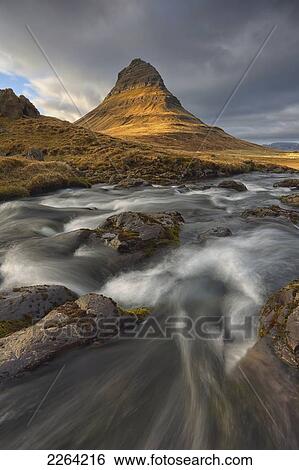 The mountain kirkjufell and waterfall kirkjufellsfoss on the snaefellsnes peninsula; grundarfjorour iceland View Large Photo Image Stock Photograph - The mountain kirkjufell and waterfall kirkjufellsfoss on the snaefellsnes peninsula; grundarfjorour iceland. Fotosearch