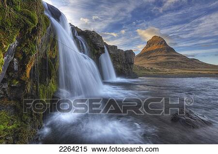 Stock Photography - The mountain kirkjufell and waterfall kirkjufellsfoss on the snaefellsnes peninsula; grundarfjorour iceland. Fotosearch