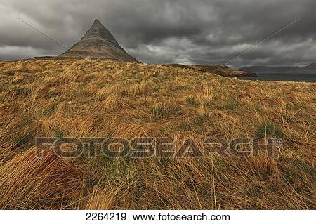Stock Photo - The mountain kirkjufell on the snaefellsnes peninsula; grundarfjorour iceland. Fotosearch