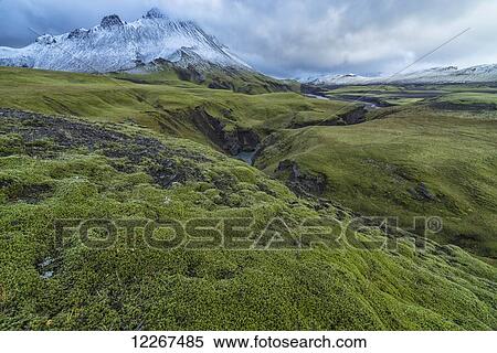 Stock Photography - The mountains and rivers of Icelands central highlands take on an otherwordly feel after the countries first snowfall; Iceland. Fotosearch