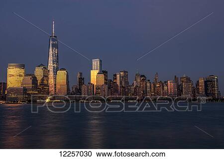 The new World Trade Center at sunset as viewed from Jersey City, New Jersey; New York City, New York, United States of America View Large Photo Image Stock Image - The new World Trade Center at sunset as viewed from Jersey City, New Jersey; New York City, New York, United States of America. Fotosearch