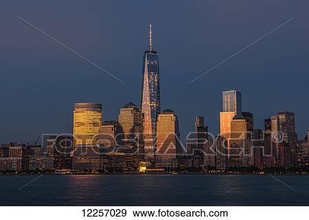 The new World Trade Center at sunset as viewed from Jersey City, New Jersey; New York City, New York, United States of America View Large Photo Image Stock Photo - The new World Trade Center at sunset as viewed from Jersey City, New Jersey; New York City, New York, United States of America. Fotosearch