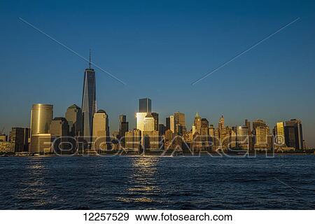 The new World Trade Center at sunset as viewed from Jersey City, New Jersey; New York City, New York, United States of America View Large Photo Image Stock Photo - The new World Trade Center at sunset as viewed from Jersey City, New Jersey; New York City, New York, United States of America. Fotosearch