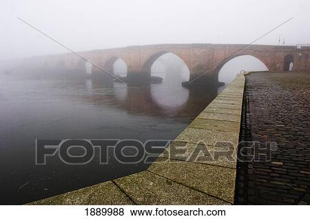 Stock Photo - The Old Bridge Covered In Mist In Berwick Upon Tweed.. Fotosearch