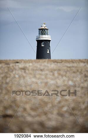The Old 'high Light Tower' At Dungeness In Kent. Built In 1904 And Standing At A Height Of 41M. View Large Photo Image Picture - The Old 'high Light Tower' At Dungeness In Kent. Built In 1904 And Standing At A Height Of 41M.. Fotosearch