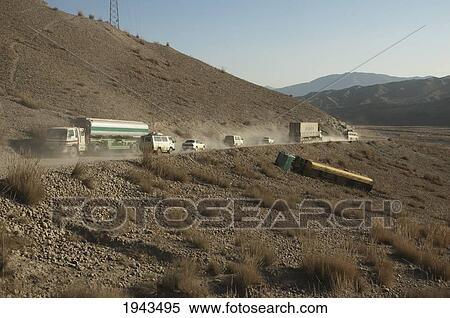 Stock Photography - The Overturned Tanker Truck Couldn't Handle The Traffic On The Dusty Kabul To Sarobi Road, Kabul Province, Afghanistan. Fotosearch