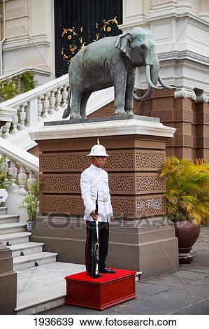 The Palace Guard Standing Outside The Royal Reception Hall Chakri Mahaprasat Hall At The Grand Palace; Bangkok Thailand View Large Photo Image Stock Photo - The Palace Guard Standing Outside The Royal Reception Hall Chakri Mahaprasat Hall At The Grand Palace; Bangkok Thailand. Fotosearch