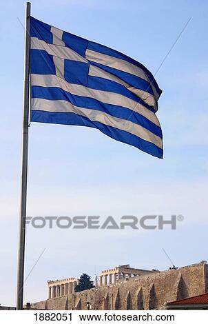 Stock Image - The Parthenon Viewed From Below With Greek Flag. Fotosearch