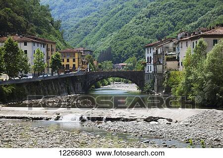 Stock Image - The quaint village of Bagni di Lucca in the Alpuan Alps; Bagni di Lucca, Tuscany, Italy. Fotosearch