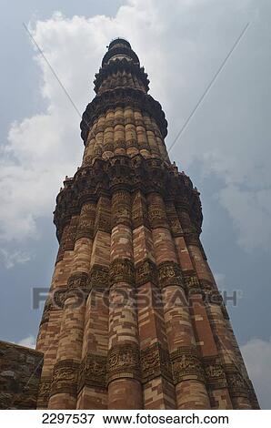 Stock Photo - The Qutab complex includes the world's tallest brick minaret - the Minar - as well as a series of Indo-Islamic buildings. Construction of the complex was started in 1193 under the orders of India's first Muslim ruler Qutb-ud-din Aibak. Much of the stone. Fotosearch