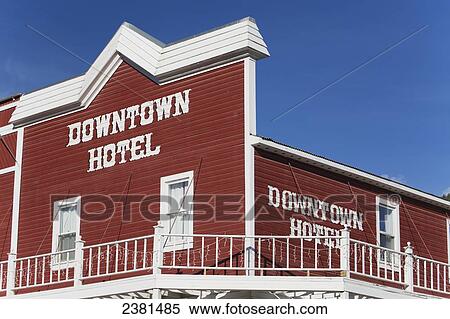 The red and white building of a downtown hotel against a bright blue sky; Dawson City, Yukon, Canada View Large Photo Image Stock Photography - The red and white building of a downtown hotel against a bright blue sky; Dawson City, Yukon, Canada. Fotosearch