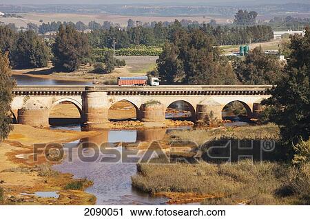 Stock Image - The Roman Bridge Crossing The Rio Tinto; Niebla, Huelva Province, Andalusia, Spain. Fotosearch