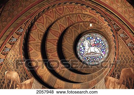 The Round Window Behind The Neo-Roman Baptising Fountain Designed By Schulek Shows A Scene From The Apocalypse Of St John: The Lamb Of God And The Sealed Book At The Matthias Church, Budapest, Hungary View Large Photo Image Stock Photo - The Round Window Behind The Neo-Roman Baptising Fountain Designed By Schulek Shows A Scene From The Apocalypse Of St John: The Lamb Of God And The Sealed Book At The Matthias Church, Budapest, Hungary. Fotosearch