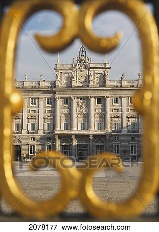 Stock Photo - The Royal Palace As Seen Through Gold Painted Details Of A Metal Fence; Madrid Spain. Fotosearch